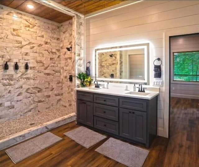 bathroom with wood walls, vanity, wood ceiling, and hardwood / wood-style flooring