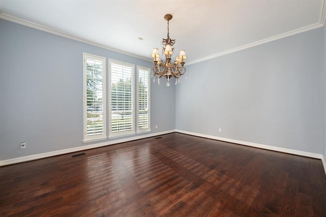 empty room featuring ornamental molding, wood-type flooring, and a notable chandelier