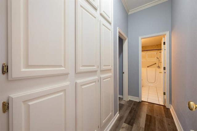 corridor featuring dark wood-type flooring and ornamental molding