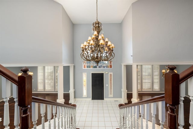 foyer entrance featuring tile patterned floors and a chandelier