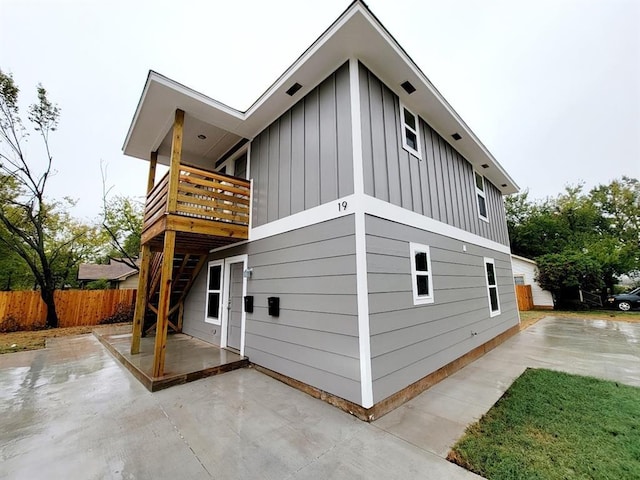 view of side of home with a patio