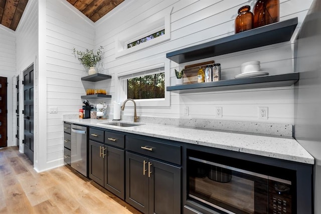 bar featuring light stone countertops, dishwasher, sink, vaulted ceiling, and wood ceiling