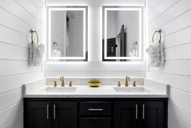 bathroom with wooden walls and vanity