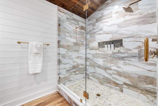 bathroom with hardwood / wood-style floors and walk in shower