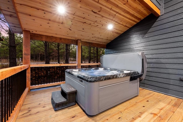 wooden terrace with a hot tub