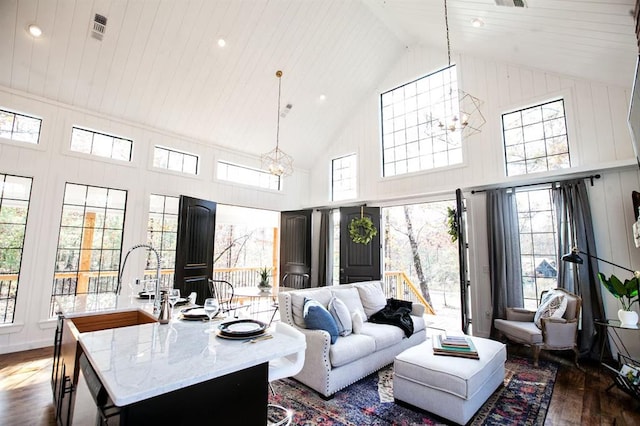 living room with high vaulted ceiling, a notable chandelier, dark hardwood / wood-style flooring, and wood ceiling