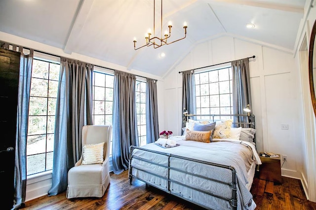 bedroom with an inviting chandelier, lofted ceiling, and dark hardwood / wood-style flooring