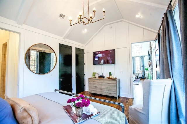 bedroom with lofted ceiling with beams, a notable chandelier, and dark hardwood / wood-style flooring