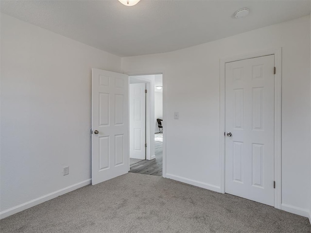 unfurnished bedroom featuring carpet flooring