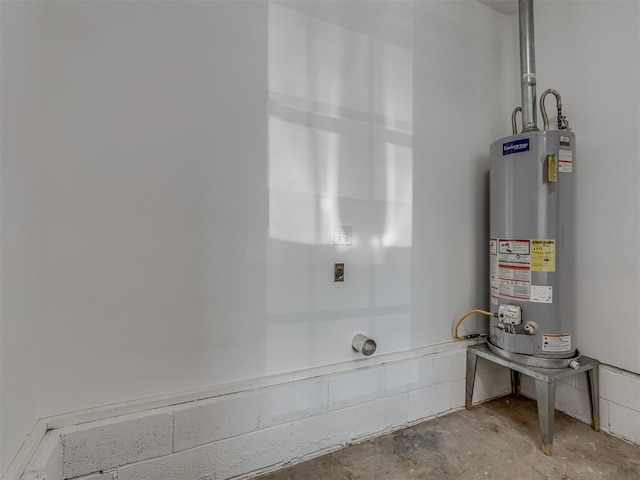 bathroom with concrete flooring and gas water heater