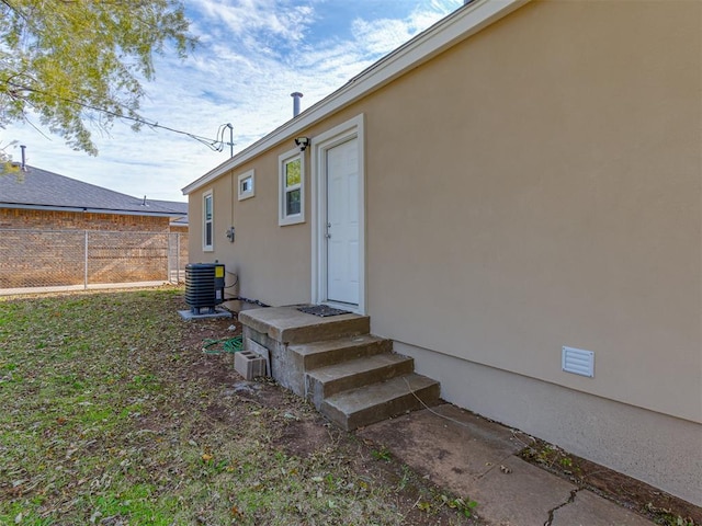 doorway to property with central air condition unit