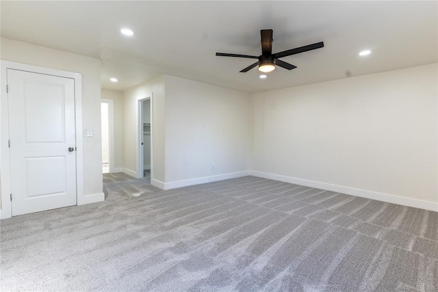 empty room with light carpet and ceiling fan