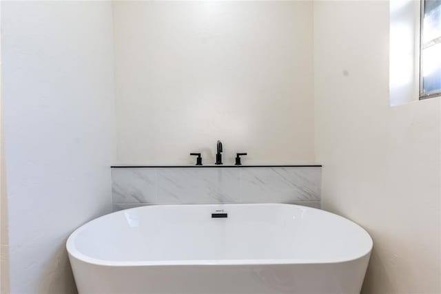 bathroom featuring a tub to relax in