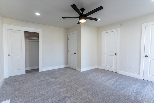 unfurnished bedroom with ceiling fan and carpet