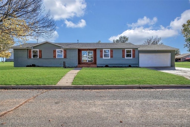 ranch-style home featuring a garage and a front lawn