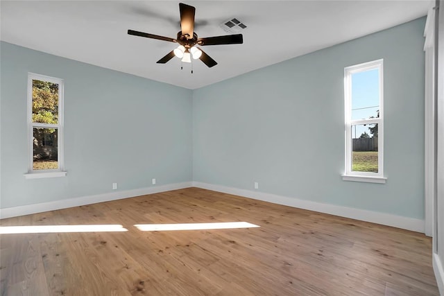 empty room with light hardwood / wood-style flooring and ceiling fan