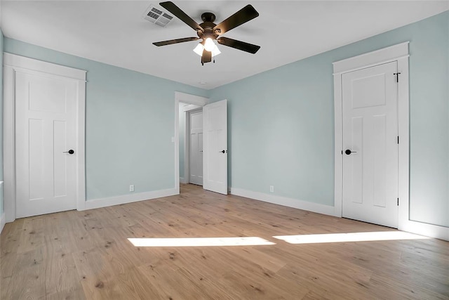 unfurnished bedroom with light hardwood / wood-style floors and ceiling fan