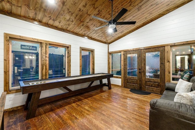 game room with french doors, vaulted ceiling, ceiling fan, wood-type flooring, and wooden ceiling