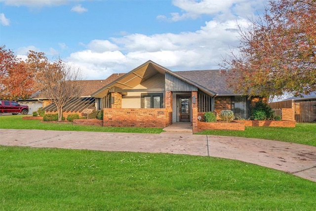 craftsman-style house with a front lawn