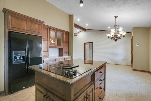 kitchen with pendant lighting, a center island, black appliances, lofted ceiling with beams, and a notable chandelier