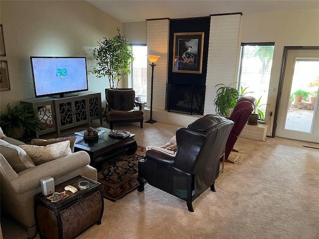 living room with light colored carpet and a brick fireplace