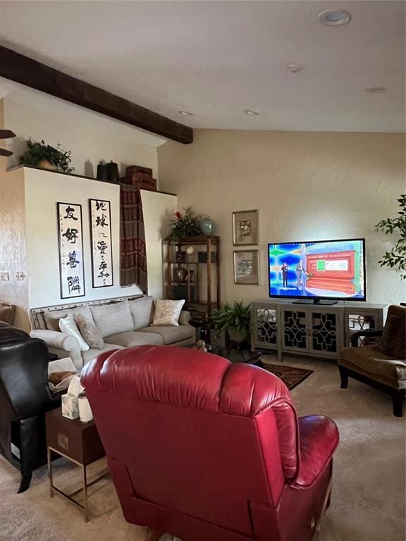 carpeted living room with beam ceiling