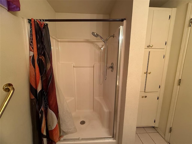 bathroom featuring tile patterned flooring and a shower with shower curtain