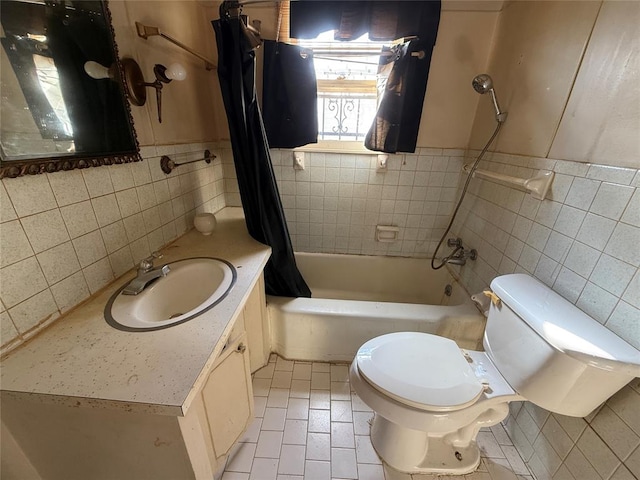 full bathroom featuring vanity, shower / bathtub combination with curtain, tile walls, tile patterned flooring, and toilet