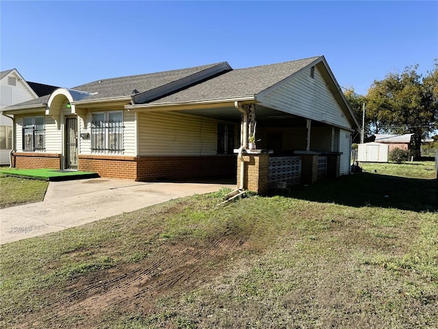 view of side of property featuring a yard and a carport
