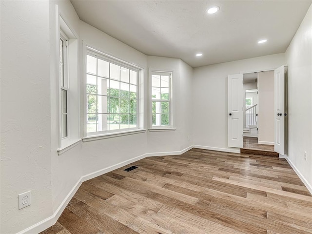 spare room featuring hardwood / wood-style floors