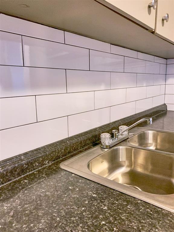 709 N 7th St Unit 6, 7, 8, & 9, Weatherford, OK 73096 - kitchen view of a sink and backsplash
