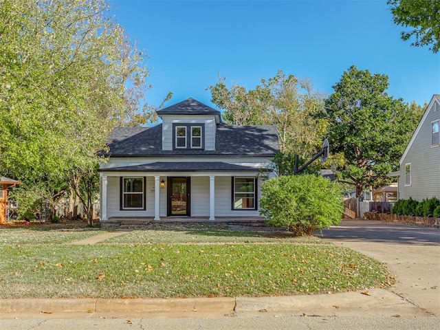 view of front of house featuring a porch and a front yard