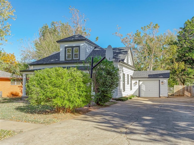 view of home's exterior with an outbuilding and a garage