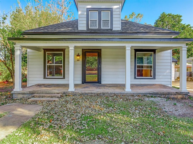 property entrance with covered porch