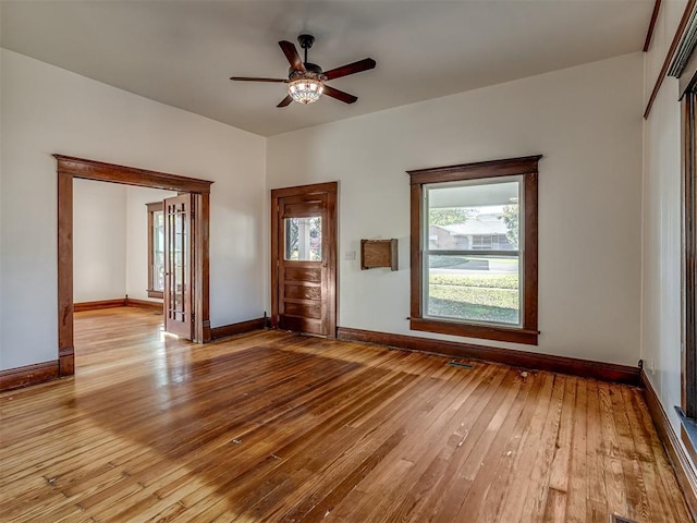 spare room with ceiling fan and light hardwood / wood-style floors