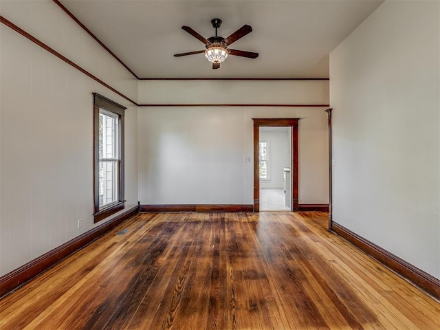 309 S 6th St, Kingfisher, OK 73750 - empty room featuring wood-type flooring, plenty of natural light, ceiling fan, and baseboards