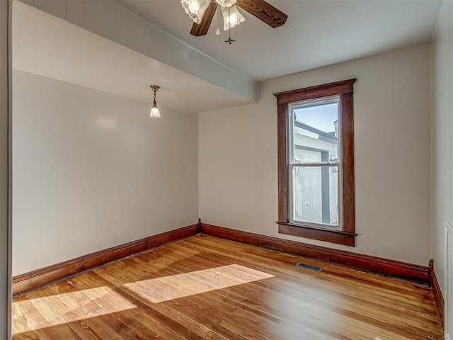 empty room with ceiling fan and light wood-type flooring