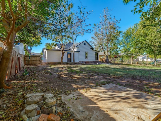 309 S 6th St, Kingfisher, OK 73750 - back of property featuring a fenced backyard and a patio