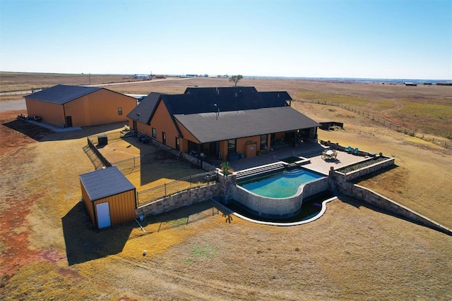 birds eye view of property featuring a rural view