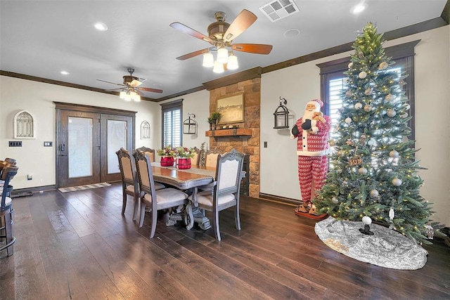 dining area with crown molding, ceiling fan, and dark wood-type flooring