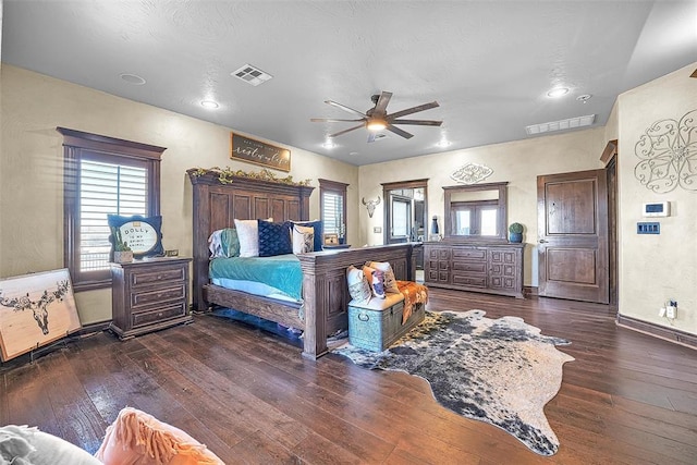 bedroom featuring ceiling fan and dark wood-type flooring