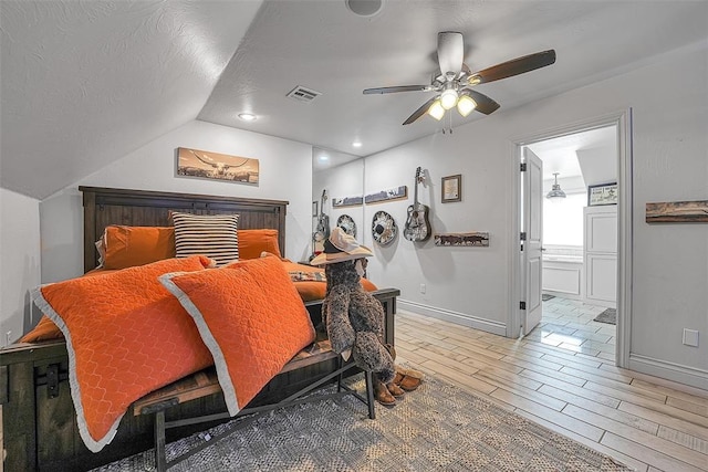 dining space with ceiling fan, a textured ceiling, and vaulted ceiling