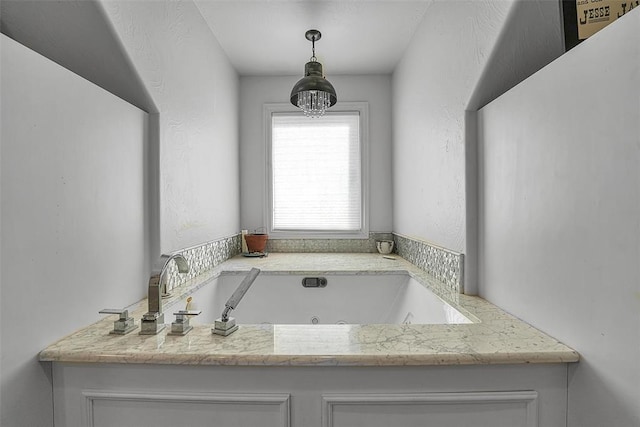 bathroom with a tub to relax in