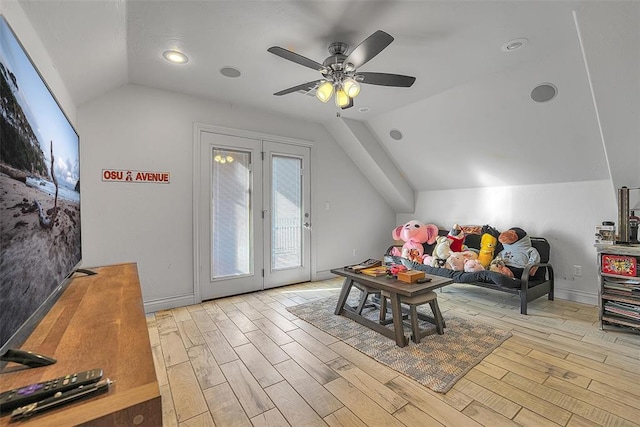 rec room featuring ceiling fan, lofted ceiling, and light wood-type flooring