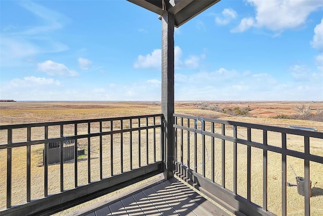 balcony featuring a rural view