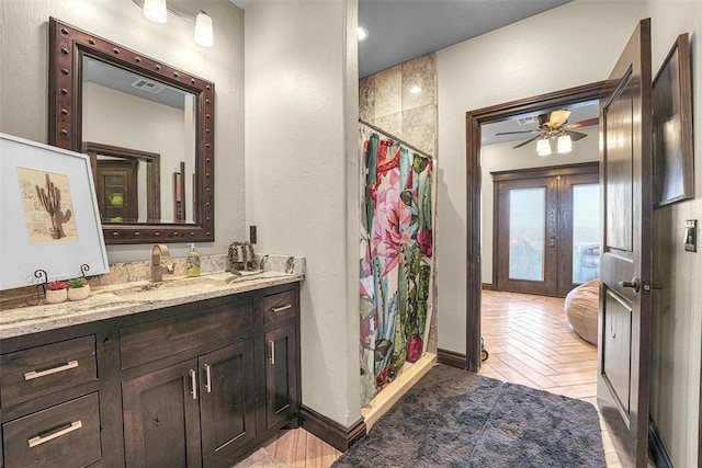 bathroom featuring vanity, french doors, tile patterned floors, ceiling fan, and walk in shower