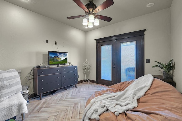 bedroom with access to outside, ceiling fan, french doors, and light parquet flooring