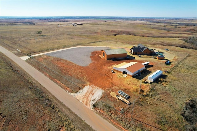 birds eye view of property with a rural view