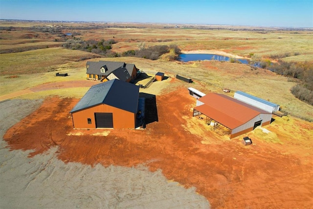 birds eye view of property with a rural view