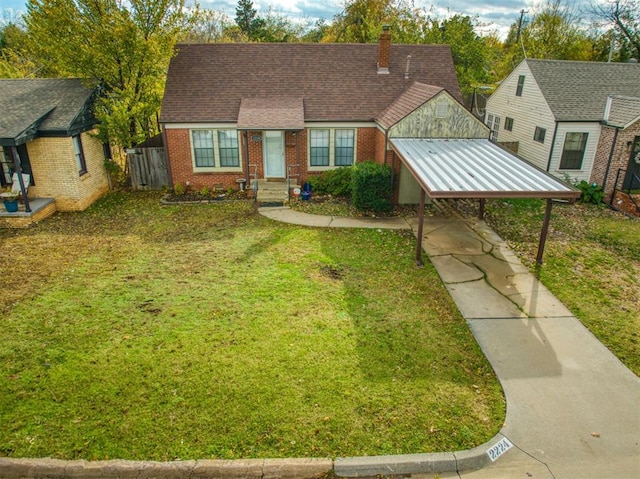 view of front of home featuring a front lawn and a carport